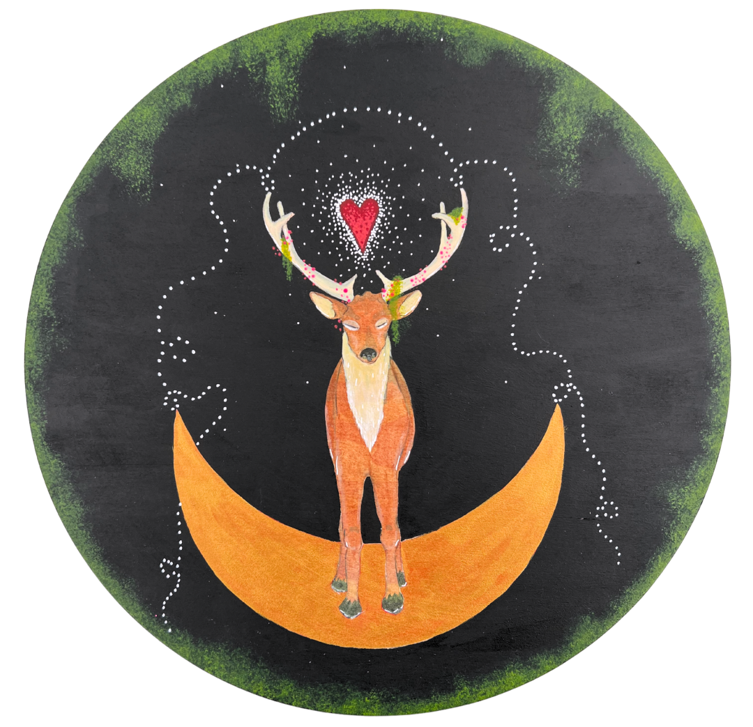 A painting of a stag, or hart, on a round wood panel. The stag is in the center, standing on a golden crescent moon. The stag's eyes are closed and its antlers are draped with moss and pink dots. Between its antlers is a red love heart with dots of white emanating from it. There are also dots of white draped from the edge of each antler and across the top, and down to the corners of the moon. The background is painted black with green moss framing the edge.